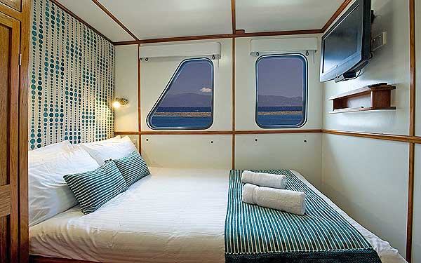 On the top deck, this 5.2 meter Square cabin is complete with double bed, 26" TV, wardrobe and Writing Desk